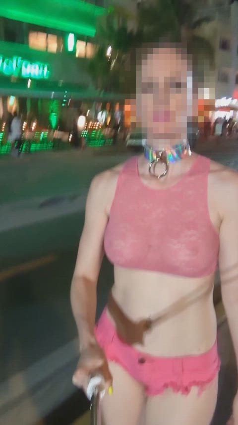 A very public walk with a submissive collar, a sheer crop top, and micro shorts.