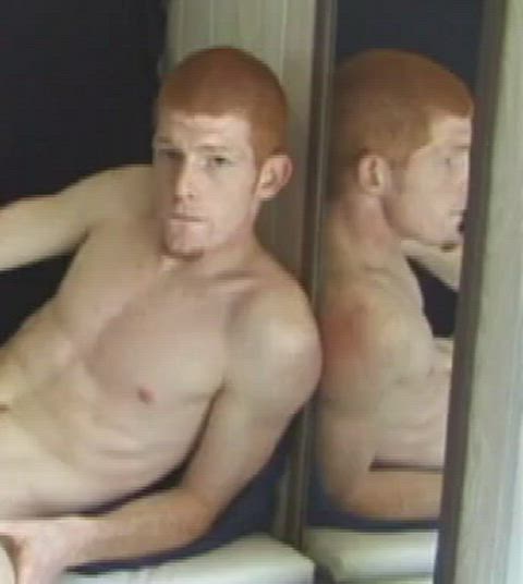 Redhead Tristan fires in front of a mirror