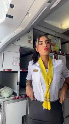 big tits brunette dancing dress stewardess tease teasing uniform gif