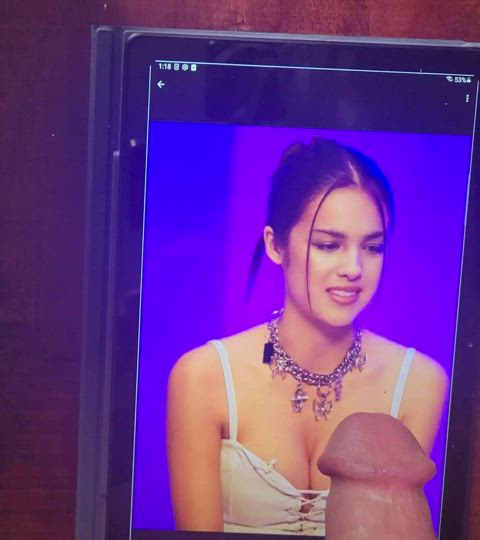 Covering her tits in cum