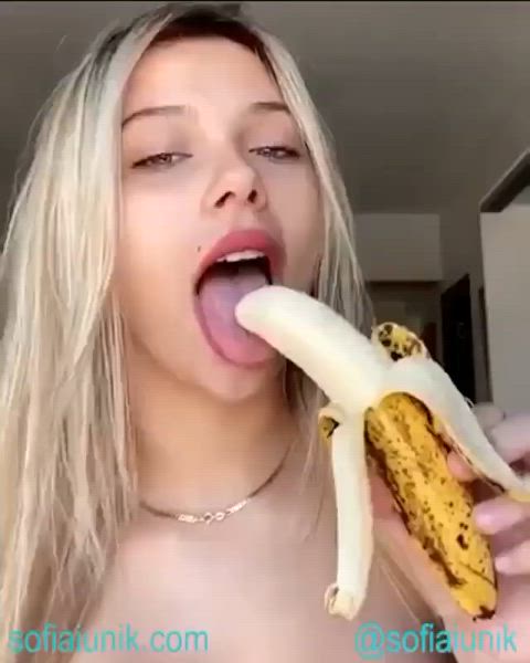 Blonde having fun with a banana