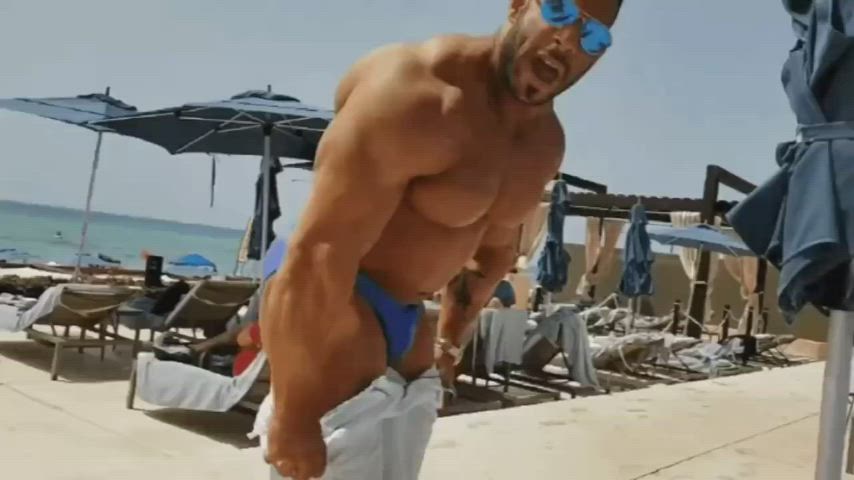 beach bodybuilder clothed gay stripping gif