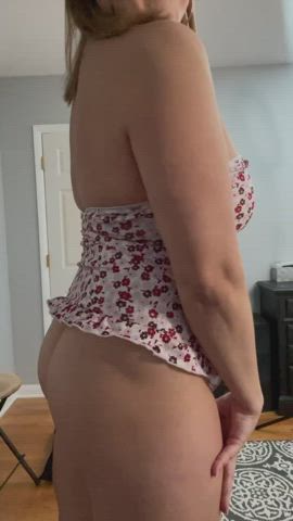 MILF putting on a mini dress