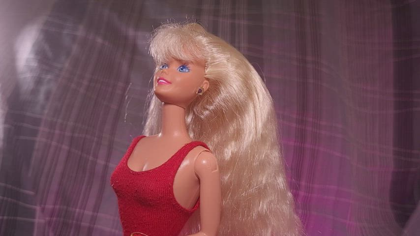Barbie in a red swimsuit experimenting with some cum