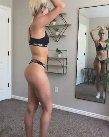 Checking herself in the mirror