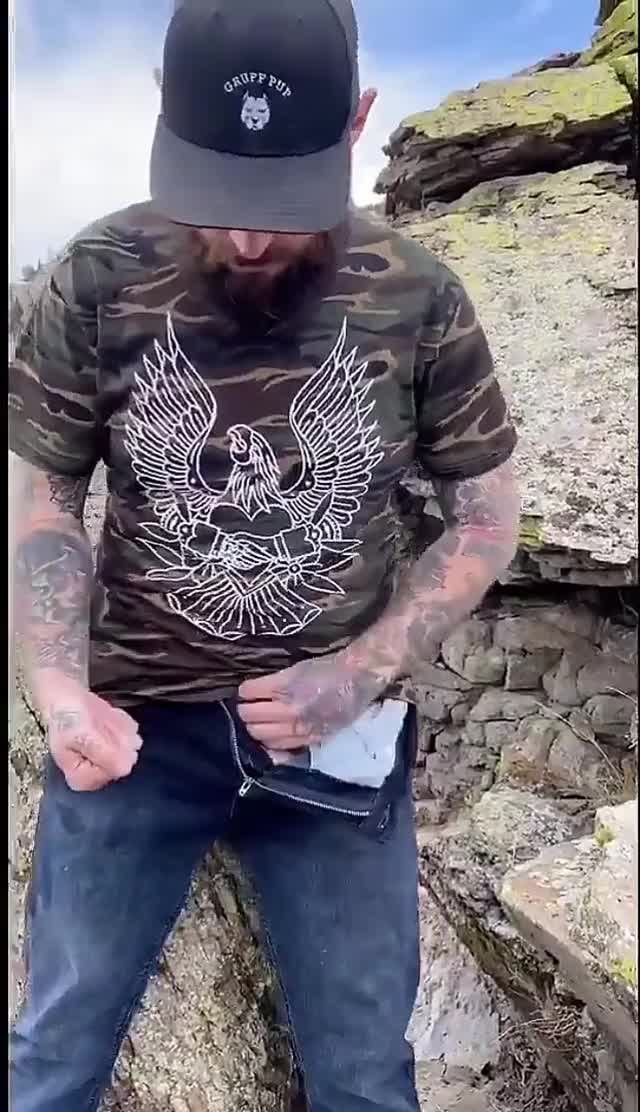 Tatted stud pulls out his cock and makes a huge mess in the great wide open