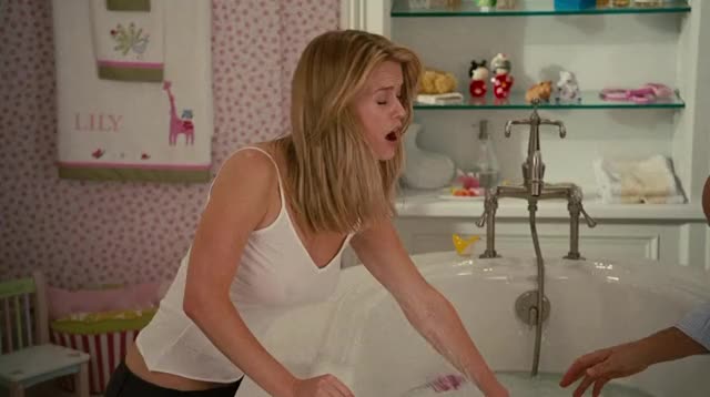 Alice Eve's jiggling tits on display through her wet shirt