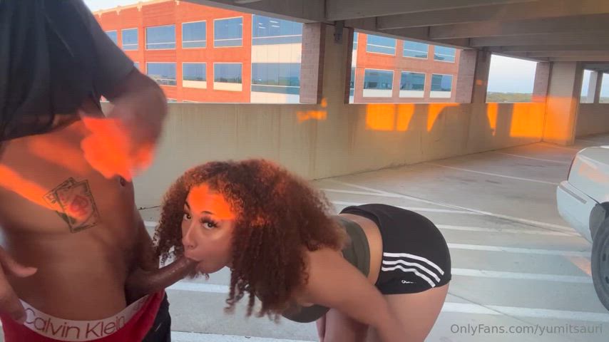 BBC blowjob in parking garage at sunset - public bj