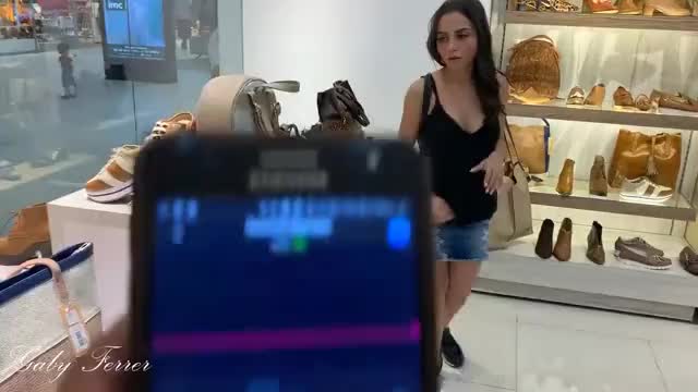 Walking around a store with remote vibrator inside her