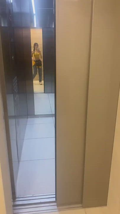 Brunette Elevator Mirror gif