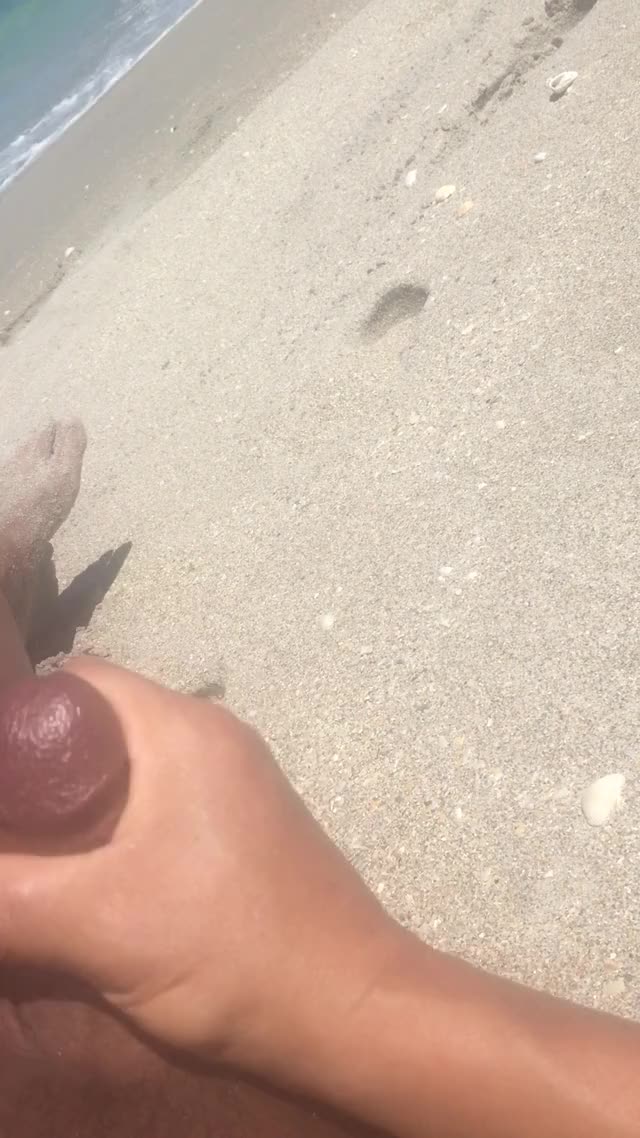 Cumming on the beach