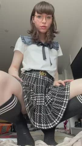 Jerking her cock in a schoolgirl outfit