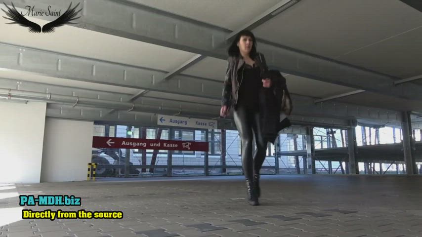 Peeing beside her car