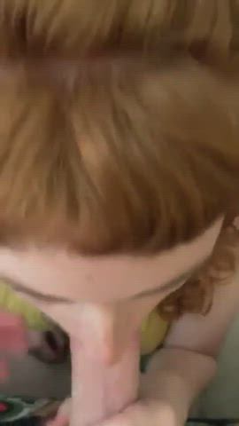 Obedient redhead sucking big white dick