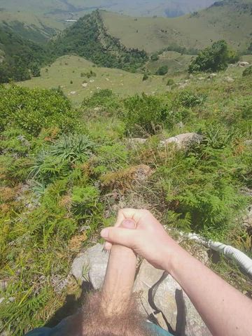 Taking a jerk off break while hiking in the mountains