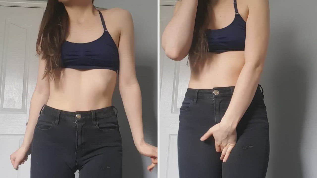 Holding on the left, letting go on the right in jeans and a cute sports bra