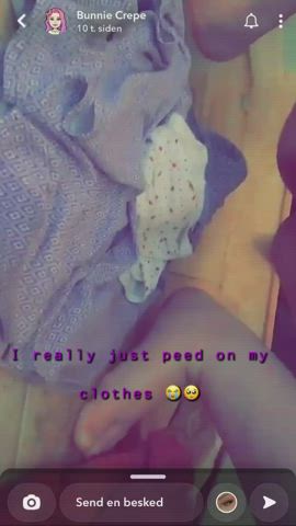 Slut peeing on her own clothes