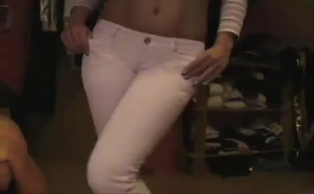 Wetting her white pants