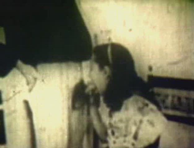 1935, Receiving a blessing from the priest